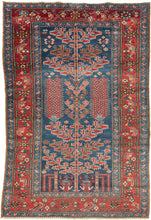 This unusual Karaja rug features&nbsp;a Tree of Life composition rendered in a vivid palette of indigo, madder, ivory, and soft terracotta tones. It combines the technical precision and geometric boldness typical of Karaja weavings with a spiritually resonant format more commonly associated with urban workshop rugs.
