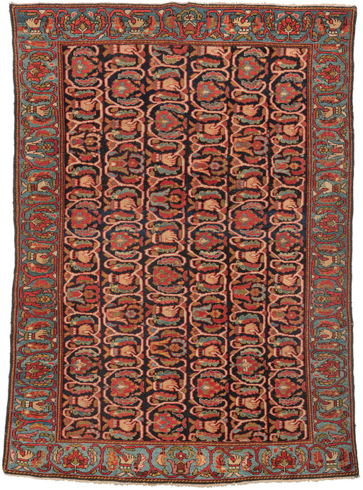 Malayer It features an unusual and very delightful pattern of weaving hands. The hands are featured in six repeating columns alternating with flowers and leaves on a navy field as well as with same design on the icy blue border. Each hand pinches what can be seen as both a vine and yarn to reference the creating of the pattern the act of weaving. Something really different and exceptional that is wonderful celebration of the medium.