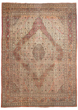 Antique Tabriz oversized rug featuring a central medallion with multiple iterations of the Herati pattern that maintains the same scale but subtly changes color combination to a great visual effect. The repeat Herati emanates in different waves from a dark brown center to soft-toned grounds of ivory, teal, and burnt orange. Four cornices work in the opposing direction and reflect color the exchange found in the center. 