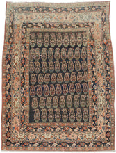 This Tabriz rug was handwoven during the early 20th century.

It features an all-over design of penguin-like&nbsp;botehs&nbsp;waddling row by row in alternating directions. The botehs shift slightly in proportion and placement giving the composition a wavy feel. Adding to the funky feel and nature of the rug the weaving style begins to change near the top from a crisper weave to a looser one while the colors used slowly begin to shift as the new weaver presumably began to run out of the original yarn.&nbsp;