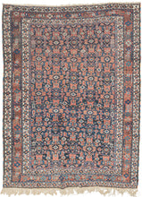 This&nbsp;Afshar&nbsp;rug was handwoven during the second quarter of the 20th century.&nbsp;

It features an all-over design that is a variation of a herati pattern. The boxy abstracted flowers are rendered in red, orange and turqouise hues on a midnight blue ground. Very figures and talismans can be found hidden amongst the field including a person on horseback and what appears to be the word "Shiraz" written in arabic script.