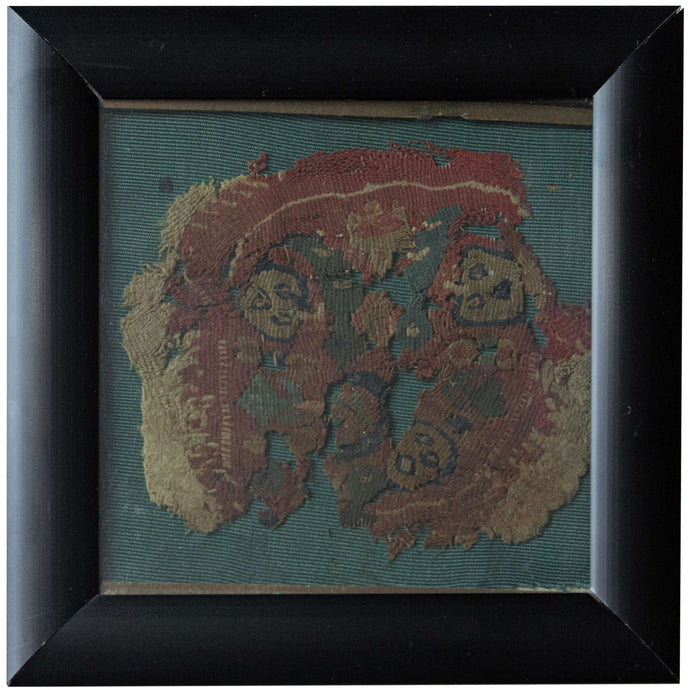 This Coptic textile was woven in Egypt or the Levant during the 6th-7th century AD.&nbsp;

It features a roundel with various faces and vegetal motifs on a earthy red ground. It is framed by rounded borders including a main latchhooked border. With tones of green, purple and yellow to go with the wheat colored linen classically found in these textiles.&nbsp;
