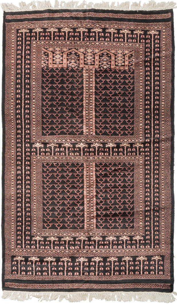 This Bokhara was woven in Pakistan during the 1980s.  With an uncommon design for Bokhara rugs it for Bokhara features a classic Ensi design and a lovely skirt border on one end all on a desirable and uncommon black ground. Ensi rugs were woven by Turkmen tribes and traditionally used as a door cover or entrance to a yurt. Their is a belief among seasoned Turkmen collectors that the intention of this pattern was to represent a door or window to the afterlife. 