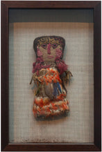 Chancay dolls that often have a simple fabric or burlap face with woven or embroidered facial features. This piece features wonderful cochineal dyed tassels and inlcudes blue and orange macaw feathers.