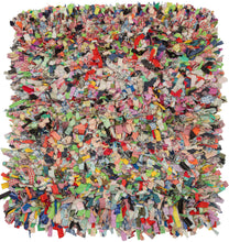 "Cotton and Wool Rag Rug", 2024  Made using recycled fabrics, giving it a distinctive multicolor and shaggy pile. Much of the fabric used features patterning giving the face an explosive feel. The wool wefting on the back of the composition is structured into neat blocks of color offering an excellent&nbsp; juxtaposition to the controlled chaos of the shaggy front. EMMA REDMOND