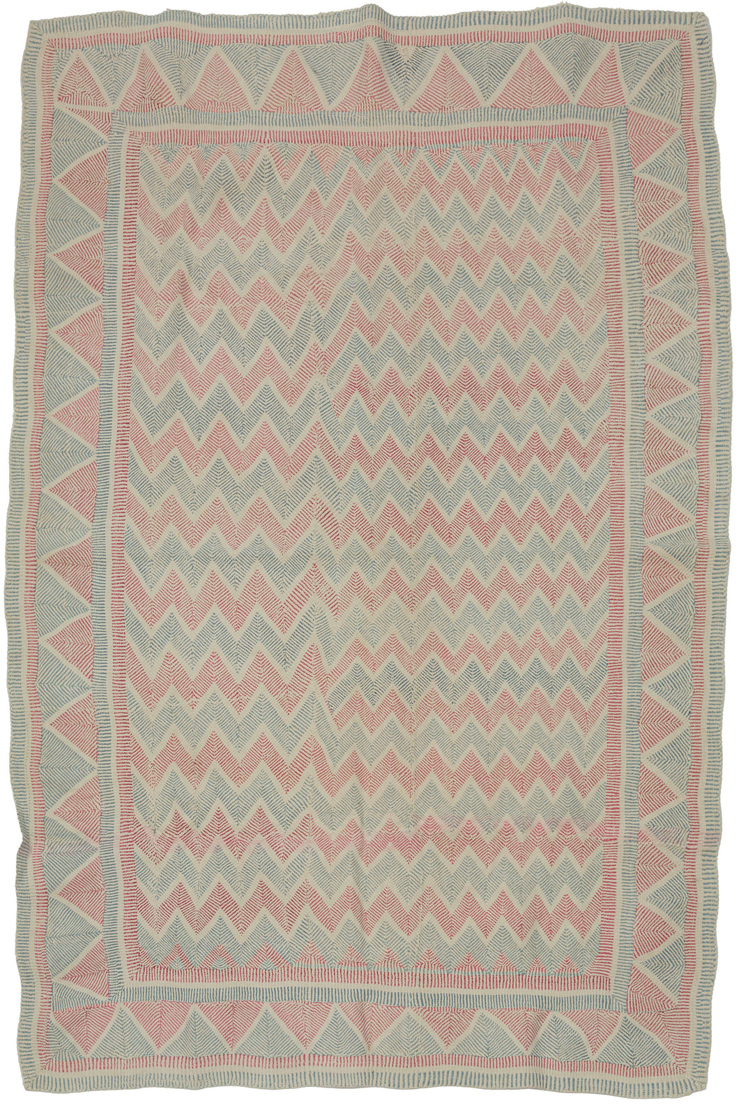 A finely worked Lahori kantha from the Rajshahi region of Bangladesh, densely embroidered in running stitch with alternating bands of faded red and soft blue. The name Lahori or Lohori is generally associated with lahar or lehar, meaning “wave,” a fitting description for the rhythmic movement created by its repeated geometric stitching.