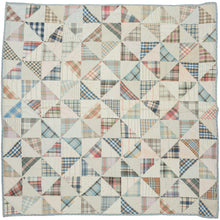 This vintage patchwork quilt was crafted in North America during the middle of the 20th century.


It features patch-worked grid composed of squares. Each square is formed of well balanced triangles of either colorful flannel patterns or more open dotted and striped cream ground patterning. The squares have been pieced together wondefully and the composition can be read many different ways that is accentuated by its perfectly square dimensions.