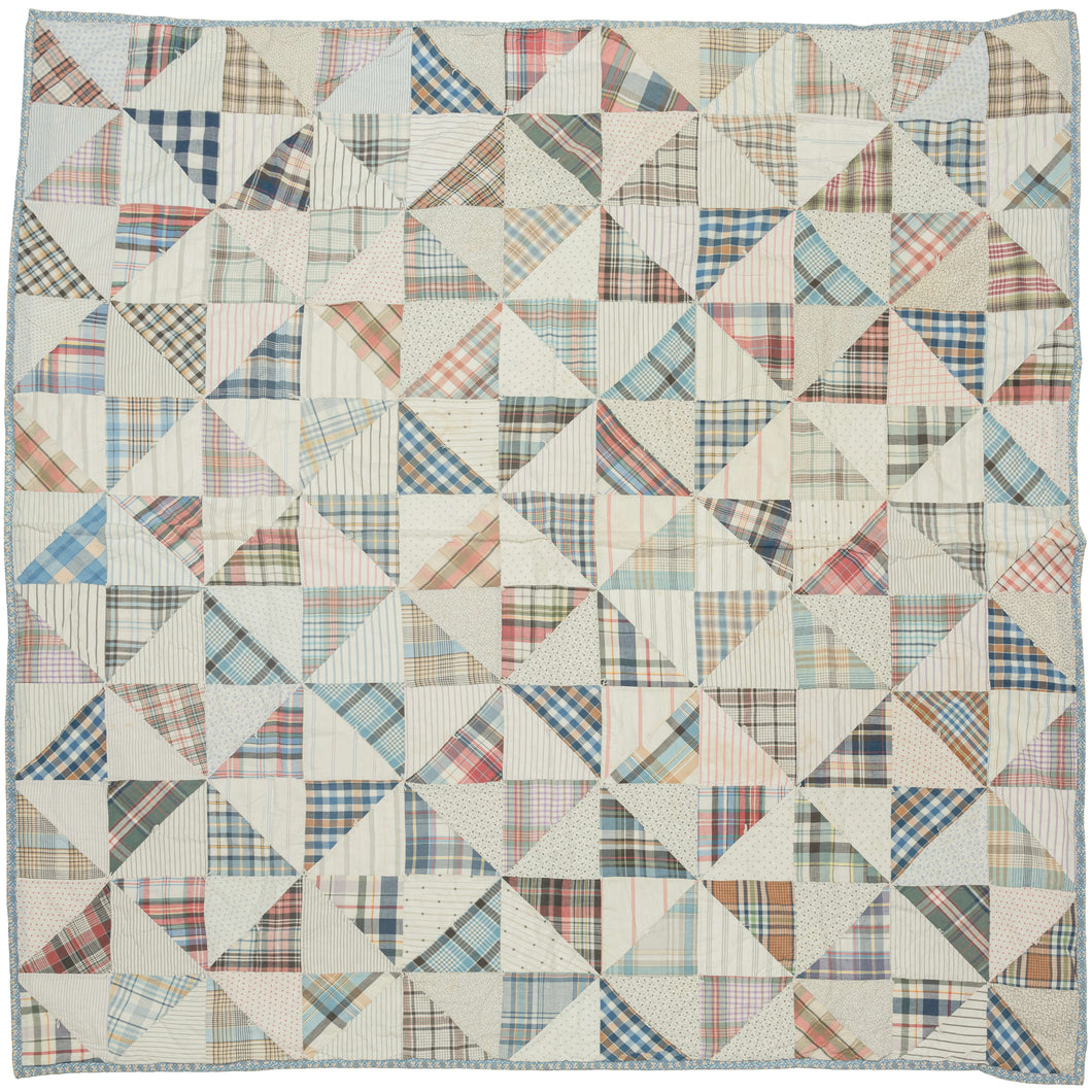 This vintage patchwork quilt was crafted in North America during the middle of the 20th century.


It features patch-worked grid composed of squares. Each square is formed of well balanced triangles of either colorful flannel patterns or more open dotted and striped cream ground patterning. The squares have been pieced together wondefully and the composition can be read many different ways that is accentuated by its perfectly square dimensions.