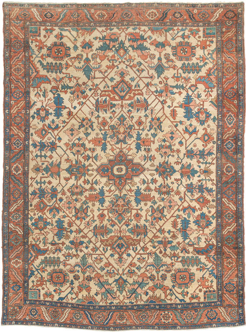 A powerful and beautifully balanced antique Serapi woven at the height of the tradition in the late 19th century. A spacious lattice is filled with large-scale, angular floral and leaf forms and set on a desirable ivory ground. The drawing is confident and architectural, with generous spacing that gives the design clarity and presence.The palette is classic and softly aged, combining brick red, terracotta, indigo, and blue-green tones against the warm ivory ground. The colors retain depth while showing the 