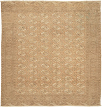 This Tekke Turkmen rug was handwoven during the second quarter of the 20th century in Turkmenistan.

The field features a grid of rounded main&nbsp;guls in various shades of brown, tan, bone and wheat on faded copper tone ground. The space between the grid is filled with rows of cruciform shaped secondary guls. It is encapsulated by a border of rams head filled octagons and finished with skirts of latch-hooked zigzags.