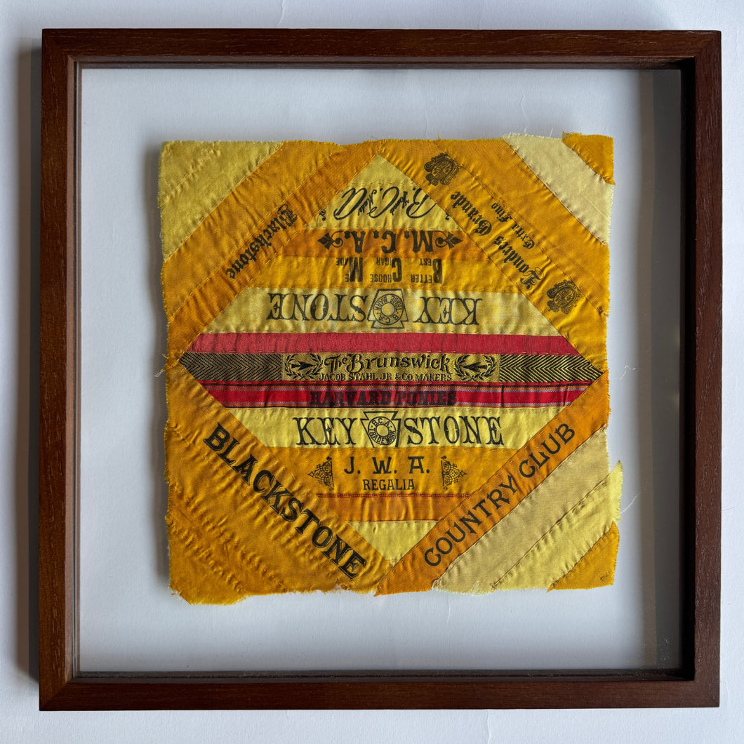 This quilts were handcrafted in United States during the turn of the 20th century.

These hand-stitched quilt panels are made from silk cigar ribbons. These pieces reflect a unique chapter in American domestic craft, when women repurposed decorative silk bands that had been used to bundle cigars into quilts, pillows and other textile art. The brand names, including Harvard, Blackstone, and Londres Extra, are framed in bold type and bright tones of yellow and orange, capturing the visual language of turn-l o