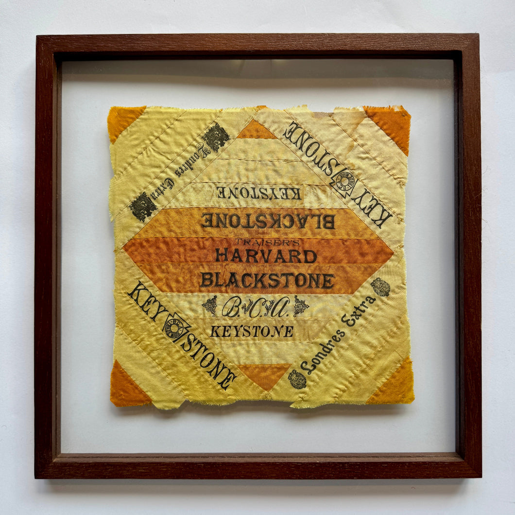 This quilts were handcrafted in United States during the turn of the 20th century.

These hand-stitched quilt panels are made from silk cigar ribbons. These pieces reflect a unique chapter in American domestic craft, when women repurposed decorative silk bands that had been used to bundle cigars into quilts, pillows and other textile art. The brand names, including Harvard, Blackstone, and Londres Extra, are framed in bold type and bright tones of yellow and orange, capturing the visual language of turn-