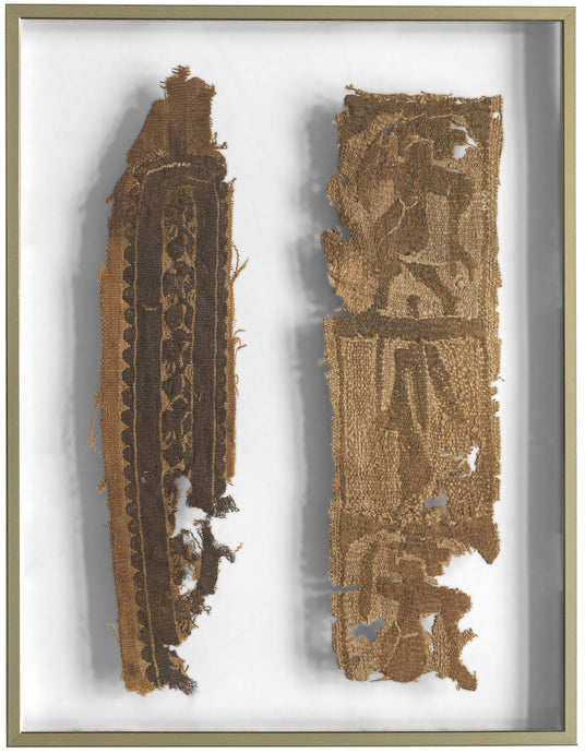 Two early Coptic tapestry-woven fragments, mounted and framed for preservation and display. Darker bands and figural elements emerge subtly from the undyed ground, their forms softened by time yet still remarkably legible.

The left fragment retains a vertical ornamental band with repeating roundels and stylized motifs, while the right preserves portions of figural decoration, likely once part of a larger tunic panel or furnishing textile. The earthy palette and rhythmic geometry are characteristic of Late 