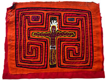 Vintage Mola cloth handmade by the Guna (previously spelled Kuna) people of the San Blas Islands.  Mola is a reverse appliqué technique, similar to the technique used in quilting but using multiple layers of different-colored cloth that are first sewn together before a design is created by cutting away different layers. These cloths are traditionally made in pairs to be worn on the front and back of women's blouses.  This Mola features the crucifixion of Jesus.  The fabric is in very good condition.&nbsp;