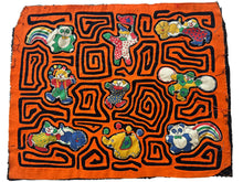 Vintage Mola cloth handmade by the Guna (previously spelled Kuna) people of the San Blas Islands.  Mola is a reverse appliqué technique, similar to the technique used in quilting but&nbsp;using multiple layers of different-colored cloth that are first sewn together before a design is created by cutting away different layers. These cloths are traditionally made in pairs to be worn on the front and back of women's blouses.  This Mola features a variety of clowns and circus animals. 