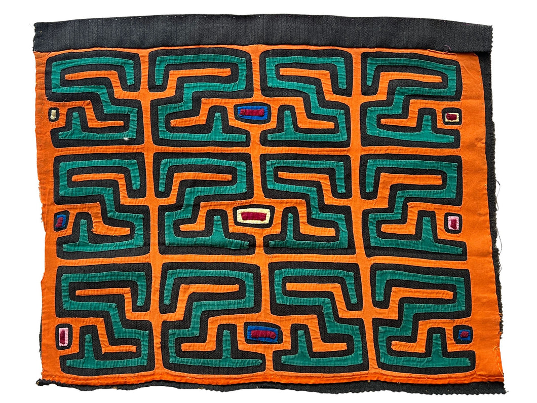 Vintage Mola cloth handmade by the Guna (previously spelled Kuna) people of the San Blas Islands.  Mola is a reverse appliqué technique, similar to the technique used in quilting but using multiple layers of different-colored cloth that are first sewn together before a design is created by cutting away different layers. These cloths are traditionally made in pairs to be worn on the front and back of women's blouses.  This Mola features a rooster. 