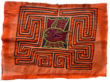 Vintage Mola cloth handmade by the Guna (previously spelled Kuna) people of the San Blas Islands.  Mola is a reverse appliqué technique, similar to the technique used in quilting but using multiple layers of different-colored cloth that are first sewn together before a design is created by cutting away different layers. These cloths are traditionally made in pairs to be worn on the front and back of women's blouses.  This Mola features a central fish form.  The fabric is in very good condition.&nbsp;