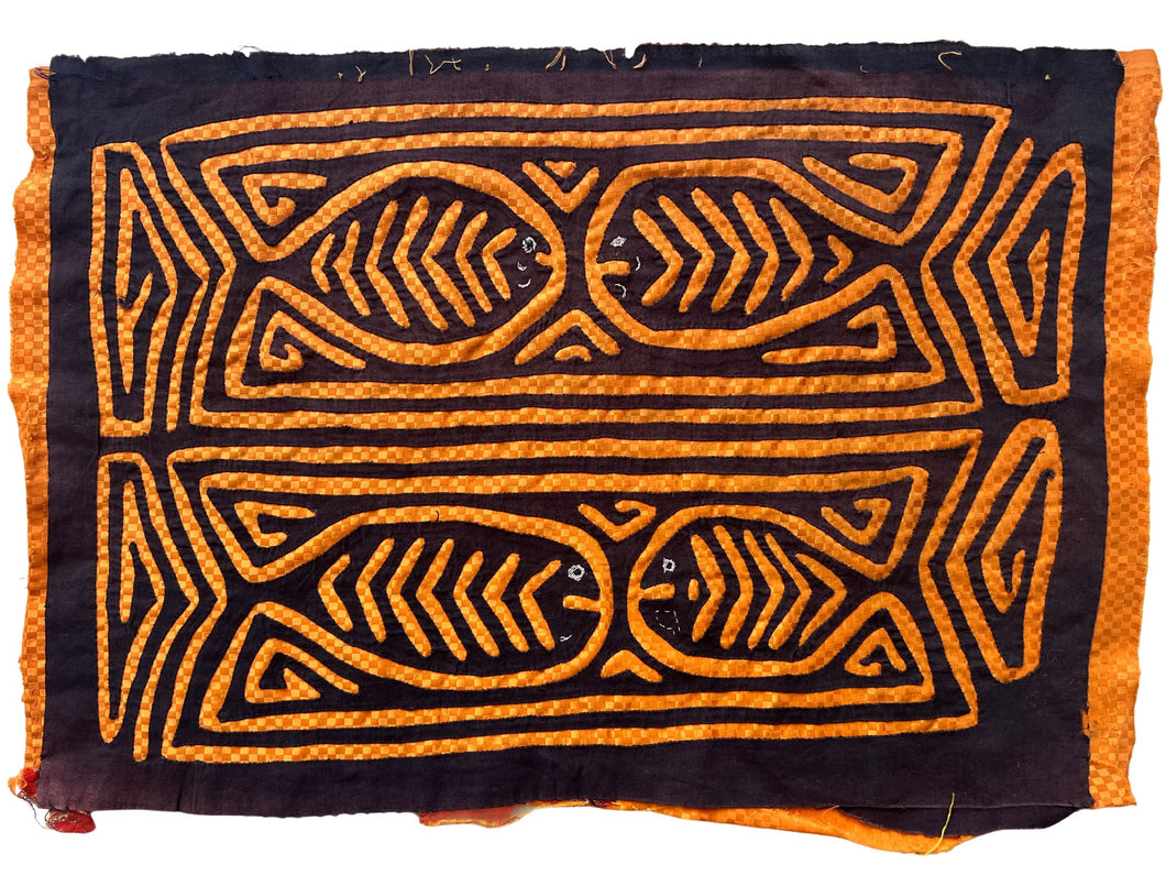 Vintage Mola cloth handmade by the Guna (previously spelled Kuna) people of the San Blas Islands.  Mola is a reverse appliqué technique, similar to the technique used in quilting but using multiple layers of different-colored cloth that are first sewn together before a design is created by cutting away different layers. These cloths are traditionally made in pairs to be worn on the front and back of women's blouses.  This Mola features a pattern of four fish.  The fabric is in very good condition.