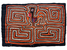 Vintage Mola cloth handmade by the Guna (previously spelled Kuna) people of the San Blas Islands.  Mola is a reverse appliqué technique, similar to the technique used in quilting but&nbsp;using multiple layers of different-colored cloth that are first sewn together before a design is created by cutting away different layers. These cloths are traditionally made in pairs to be worn on the front and back of women's blouses.  This Mola features an orange rooster.