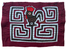 Vintage Mola cloth handmade by the Guna (previously spelled Kuna) people of the San Blas Islands.  Mola is a reverse appliqué technique, similar to the technique used in quilting but&nbsp;using multiple layers of different-colored cloth that are first sewn together before a design is created by cutting away different layers. These cloths are traditionally made in pairs to be worn on the front and back of women's blouses.  This Mola features a rooster. 