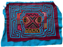 Vintage Mola cloth handmade by the Guna (previously spelled Kuna) people of the San Blas Islands.  Mola is a reverse appliqué technique, similar to the technique used in quilting but&nbsp;using multiple layers of different-colored cloth that are first sewn together before a design is created by cutting away different layers. These cloths are traditionally made in pairs to be worn on the front and back of women's blouses.  This Mola features a skull