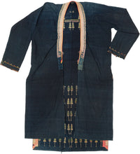 A remarkable ceremonial coat of the Tai Dam, or Black Tai, an ethnolinguistic group historically centered in northwestern Vietnam and neighboring Laos. Known as a sua hi, garments of this type were made for important ritual occasions and were particularly associated with funerary traditions and the passage of the deceased into the ancestral realm.