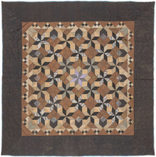 This exceptional quilt draws from the Mennonite tradition of bold geometric design. The classic LeMoyne Star, an eight-pointed star pattern introduced in America in the 19th century, is repeated and shaded to create a striking tumbling-block illusion across the entire field. The piecing demonstrates remarkable precision, with diamonds crisply aligned to build a rhythm of cubes and stars that shift depending on the viewer’s eye.