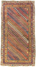 An exceptional Kurdish rug distinguished above all by its top-notch color and superb wool. The field is composed of lively diagonal bands, each carrying a different floral or geometric repeat and shifting through saturated brick red, deep indigo, grassy green, ivory, ochre, aubergine, and soft rose.