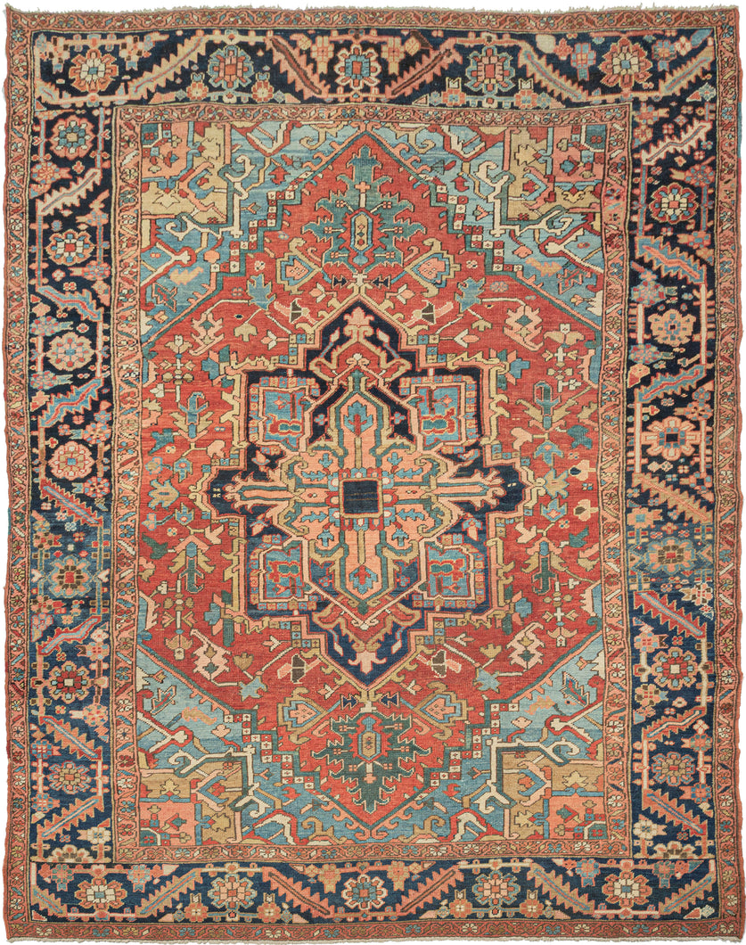 This classic Heriz features a geometric central medallion on rich saturated tones and meaty wool. A brick-red field is complemented by deep navy, french blue, sage, and coral tones with brass and ivory accents. The four teal cornices soften the rug and a wonderful undulating abrash adds layers to the composition. The main border is wider than most and gives the piece a grander feel.