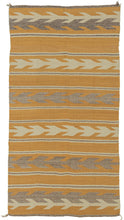 This Navajo rug was handwoven during the second quarter of the 20th century.

This Navajo rug features a warm golden fields framed by crisp stepped “arrow” or chevron bands in cream and a soft, muted purple. The alternating bands create a gentle, rhythmic movement across the textile. The palette is uncommon yet harmonious showcasing the beauty of handspun wool and classic Navajo design logic.