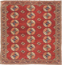 This Tekke main rug was handwoven during the first quarter of the 20th century in Turkmenistan.

The field features a grid rounded main guls in apricot, indigo, turquoise and ivory on vibrant red ground. The space between the grid is filled with rows of cruciform shaped secondary guls. In a rare square format that allows for very luxurious and open spacing of the guls.