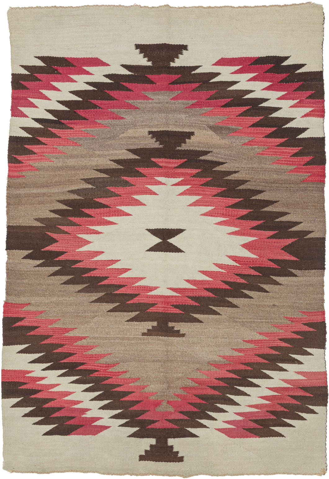 This bold&nbsp;vintage Navajo weaving is defined by its graphic composition and striking palette. A large serrated diamond anchors the design, while rhythmic stepped forms and broad expanses of natural gray wool create a dynamic interplay of movement and negative space.