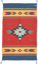 A bright contemporary Oaxacan flatwoven rug by Zapotec weavers from Teotitlán del Valle, Oaxaca. The design features a bold red field with a central stepped diamond medallion, flanked by arrow and diamond borders in blue, yellow, green, turquoise, orange, and red.