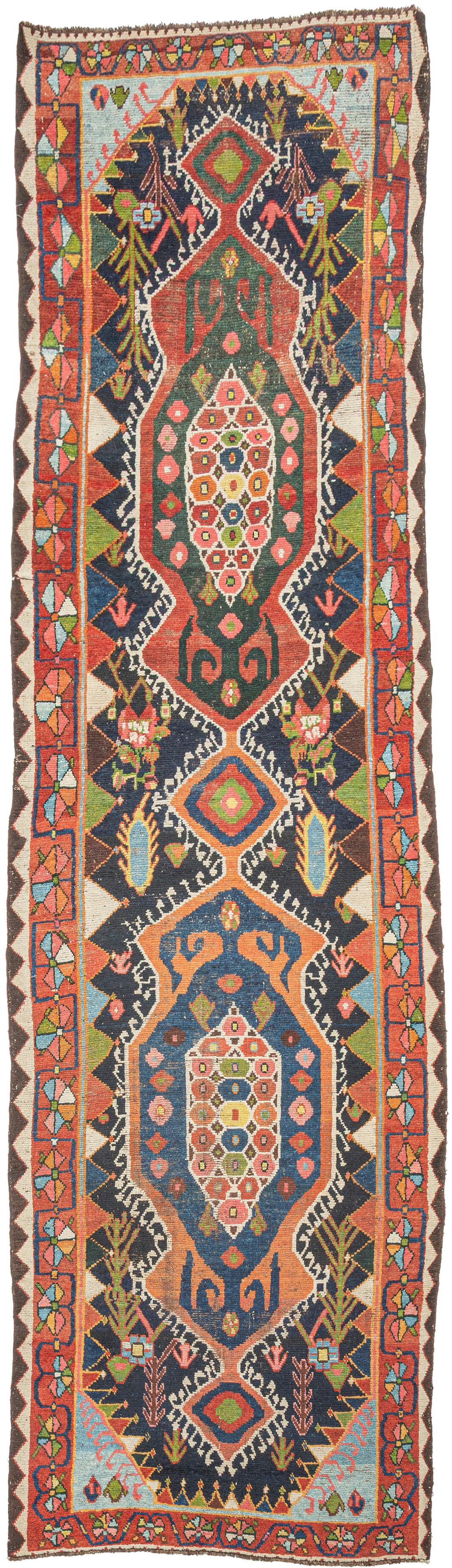 Bakhtiari Gabbeh runner from Southwest Persia with stepped medallions, geometric and stylized floral motifs in coral, indigo, teal, and ivory, arranged in a vertical layout with patterned borders.