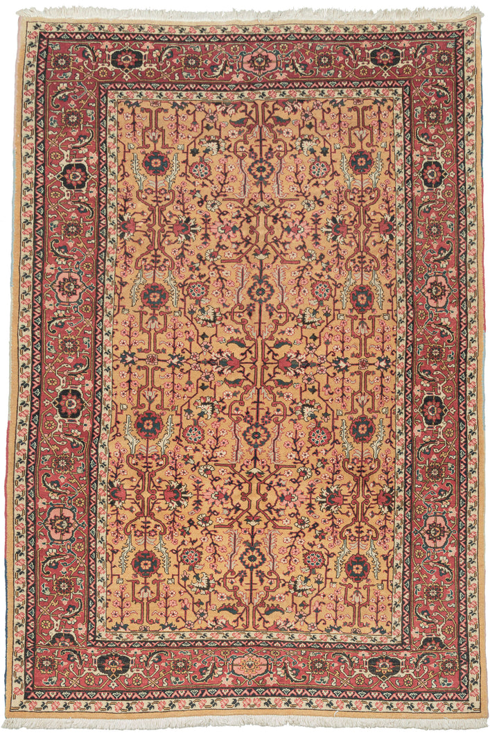 yellow heriz It features a symmetrical all over garden lattice that is densely populated with stylizes floral rosettes, palmettes, and leafy vines in soft coral, midnight blue, ivory and pistachio on a rare golden yellow ground.  The red ground main border is composed of blossoming palmettes and crisply rendered saz leaves. A soft-spoken palette that is well-balanced plays off of contrast. Densely woven of high-quality wool making a hard-wearing new production piece that properly honors