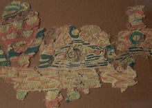 This Coptic textile was woven in Egypt or the Levant in the 6th century AD.&nbsp;

This colorful pieces features a fragment that is hard to decipher but includes various naturalistic shapes and maybe even a fish. It has evolved into very abstract rendering that can be read in many different ways.