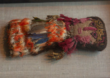 Chancay dolls that often have a simple fabric or burlap face with woven or embroidered facial features. This piece features wonderful cochineal dyed tassels and inlcudes blue and orange macaw feathers.&nbsp;