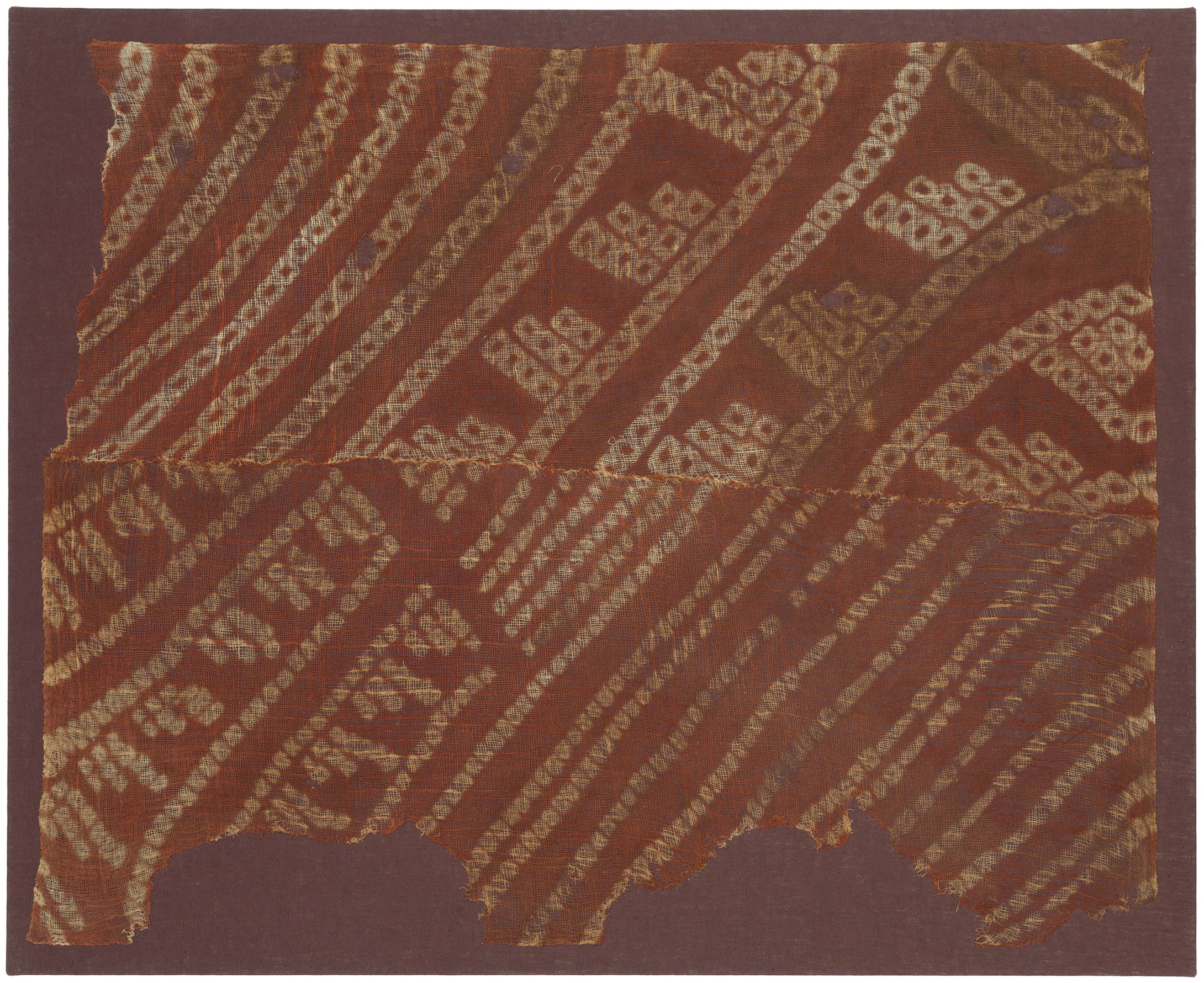 Created using a sophisticated resist-dye technique, the design reveals the remarkable precision and technical mastery of Wari textile makers. The sheer, open weave lends the composition an ethereal quality, while its beautifully weathered surface offers a tangible connection to the ancient Andean world. ￼