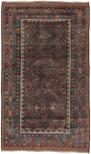 A soulful midcentury Mashwani Baluch rug with a wonderfully atmospheric palette and tribal presence. The field is built around a repeating latch-hook pattern, softened by age and wear into a smoky ground of aubergine, charcoal, madder, and faded brown. Around it, the borders bring the piece to life with small bursts of turquoise, orange, red, ivory, and green.