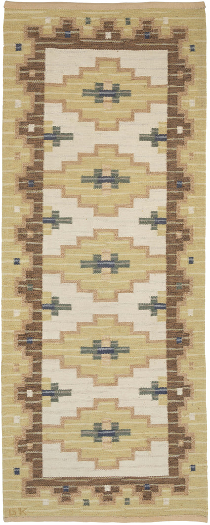 This kilim was handwoven during the middle of the 20th Century in Sweden.

This very architectural composition features a border of stepped polygons surrounded with the a border that echoes the field by using waves of rhythmic intersecting blocks. Rendered in a warm, earthy palette of chestnut, wheat, cream, slate, moss and red clay. Signed with the initials 