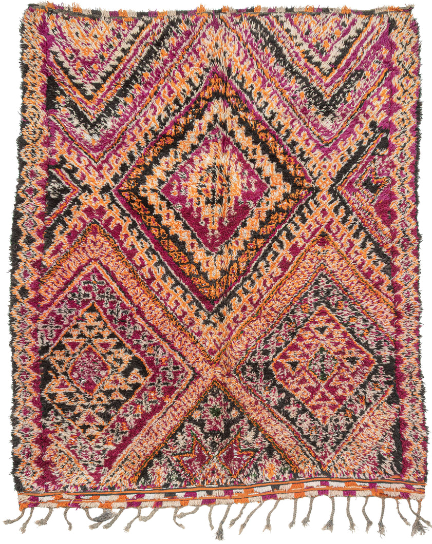 It features a bold diamond design in a striking palette of magenta, orange, black and ivory, accented with intricate lattice and geometric motifs. The vibrant colors and dynamic patterning reflect the artistic spirit of the Zemmour weaving tradition. In a very rare large squarish size. Perfect for adding energy and warmth to any space.  A very free-spirited weaving.
