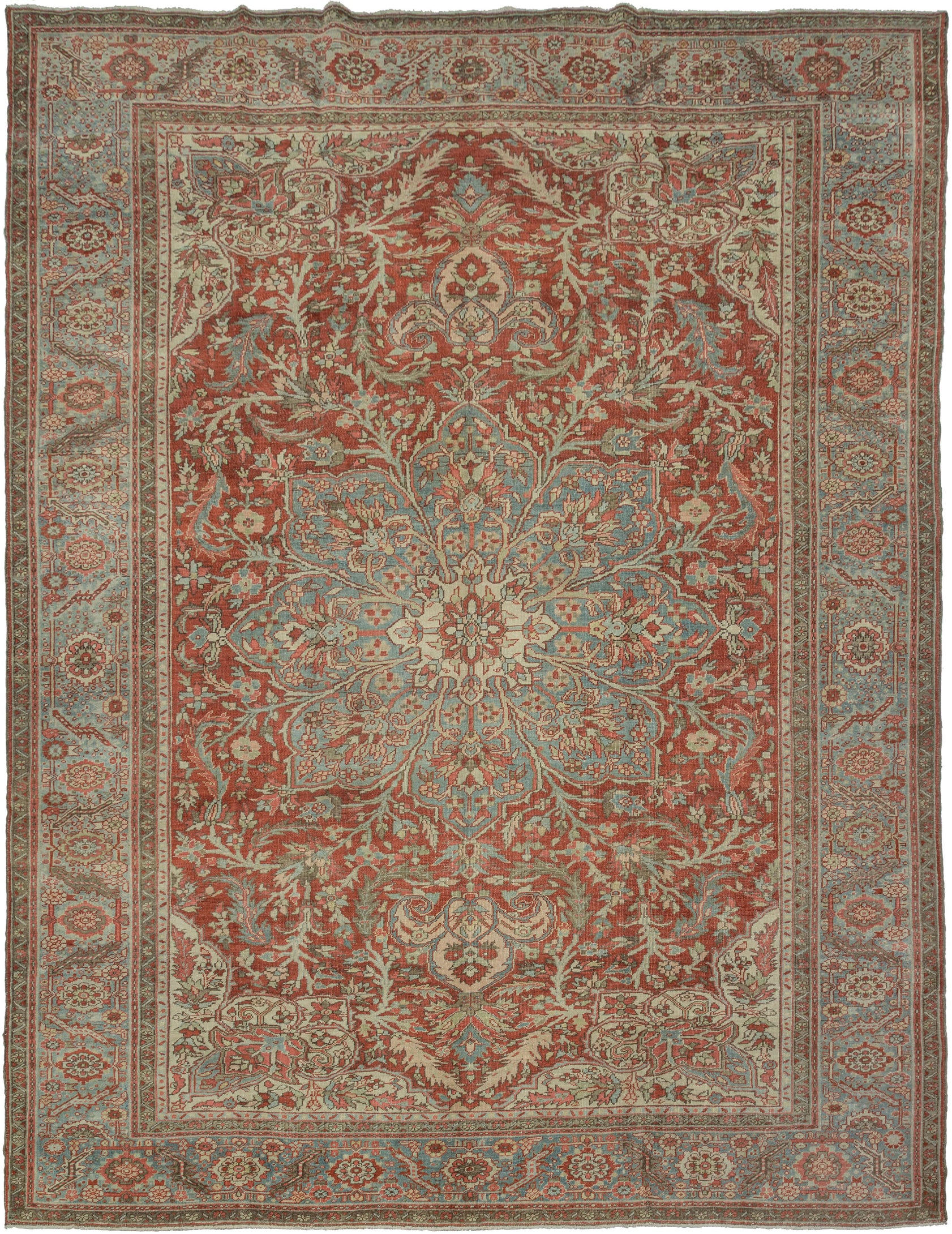 A commanding Heriz rug distinguished by a more ornate, curvilinear drawing than the classic, highly angular Heriz style. The richly saturated red field is centered by a large, radiating medallion with scrolling floral forms that lend fluidity and movement to the composition.