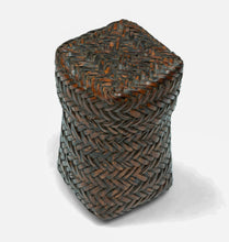 A finely made lidded basket attributed to the Kuba peoples of the Democratic Republic of the Congo, constructed from broad strips of plant fiber in a tightly worked herringbone plait.

The tall, compact form is animated by a bold chevron pattern that shifts direction across the surface, giving the basket a distinctly architectural quality. The fitted lid continues the same interlocking weave, creating a unified sculptural form when closed.