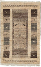 contemporary gabbeh It features a thick central rectangle of various flora and fauna in various shades of undyed wool on a cream backdrop. The central rectangle is flanked by two strips of totemic squares, each filled with either an animal or vegetal motif. The top and bottom are framed a brown interlaced band. The pile is densely woven, making this a plush rug.