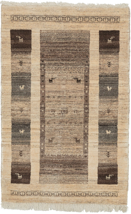 contemporary gabbeh It features a thick central rectangle of various flora and fauna in various shades of undyed wool on a cream backdrop. The central rectangle is flanked by two strips of totemic squares, each filled with either an animal or vegetal motif. The top and bottom are framed a brown interlaced band. The pile is densely woven, making this a plush rug.