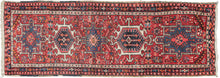 karaja It features a pattern of alternating geometric shapes and hooked lozenges on a rich red ground. Blues, reds, pinks, orange, and ivory provide a nice pop of color in a small rug. In a rare and desirable narrow and short runner format.