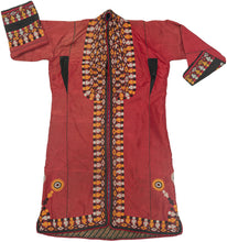 This lovely chapan is crafted from crimson striped silk. It is embellished with fine black, white, and yellow embroidery around its perimeter and up the sides. The embroidery is well executed more ornate than is standard for this type. There are three lovely floral forms on the bottom right and left of the jacket that also set it apart. A blue printed liner adds another element of interest.