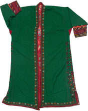 This lovely chapan is crafted from green wool. It is embroidered with an array of tones including black, red, white, orange and purple around its perimeter and up the sides. The tendrils of a tree of life or other plant form are found aroudn the slits on both sides. A red printed floral liner adds another element of interest.&nbsp;