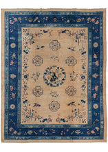 Antique Chinese Fa-Ti roomsize rug featuring a simple central medallion depicted plant filled vases. There are pictorial scenes of birds and flowers lightly drawn in blue on a tan ground. A large indigo main border and showcases flowering lotuses and coins among other auspicious symbols representing the “eight precious things”.
