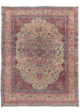 Antique Persian Lavar Kerman room size rug featuring intricate central medallion with a curvilinear floral design and scalloped cornices. The cornices are distinct but have a continuous feel with the large and medallion each with an apricot finial device on a scarlet  rosette filled backdrop. 